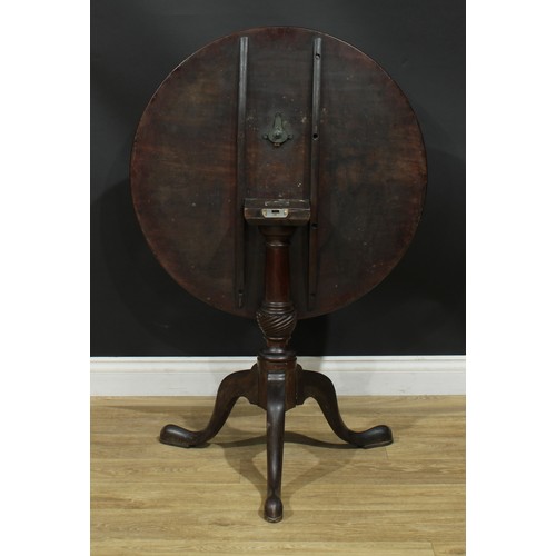 207 - A George III mahogany tripod occasional table, circular one-piece tilting top, turned column, cabrio... 