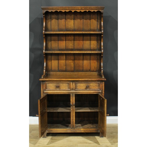 214 - An oak dresser, by Maple, 184cm high, 91.5cm wide, 45.5cm deep; a Jaycee oak bookcase, 136cm high, 9... 