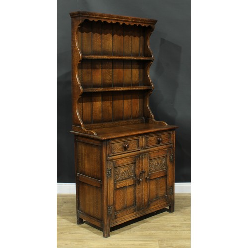 214 - An oak dresser, by Maple, 184cm high, 91.5cm wide, 45.5cm deep; a Jaycee oak bookcase, 136cm high, 9... 