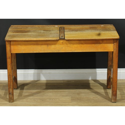 216 - An early 20th century oak double school desk, 66.5cm high, 103cm wide, 46cm deep