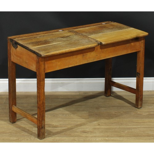 216 - An early 20th century oak double school desk, 66.5cm high, 103cm wide, 46cm deep