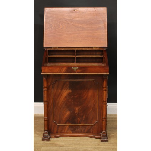 219 - A Regency style Davenport desk, 84cm high, 59cm wide, 51cm deep