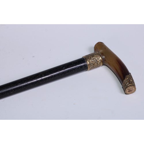 287 - A 19th century gilt metal mounted walking stick, L-shaped horn handle, ebonised cane