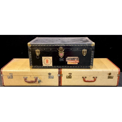 700 - An early to mid 20th century steamer trunk, with various luggage labels including Peninsular & Orien... 