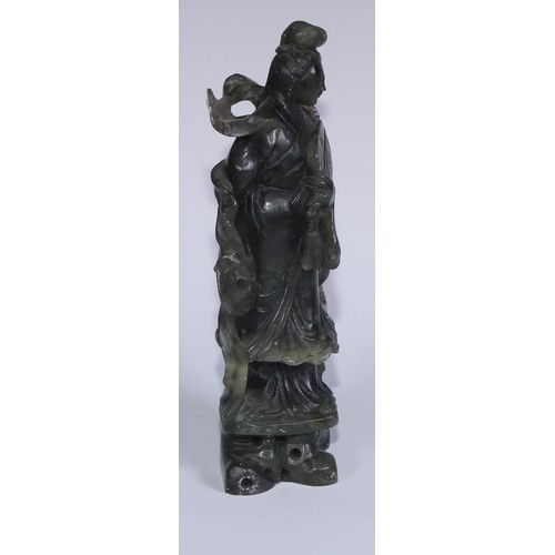 67A - A Chinese carved jade figure, of a courtesan holding a rabbit, 29cm high; another, holding a fan, 20... 