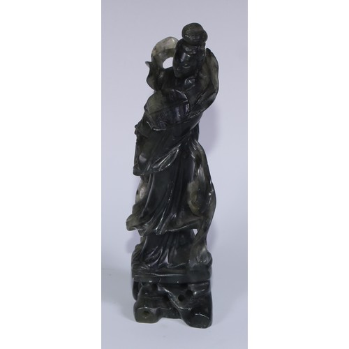 67A - A Chinese carved jade figure, of a courtesan holding a rabbit, 29cm high; another, holding a fan, 20... 