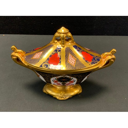 24 - A Royal Crown Derby Imari 1128 pattern twin-handled oval navette urn and cover, 14cm high, printed m... 