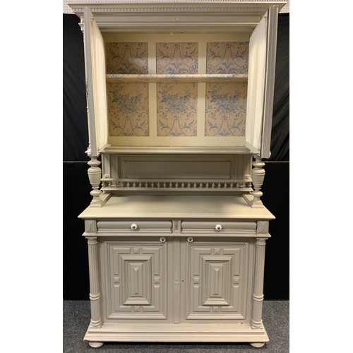 67 - An early 20th century French painted narrow dresser, dentil cornice, pair of glazed doors to top, tu... 