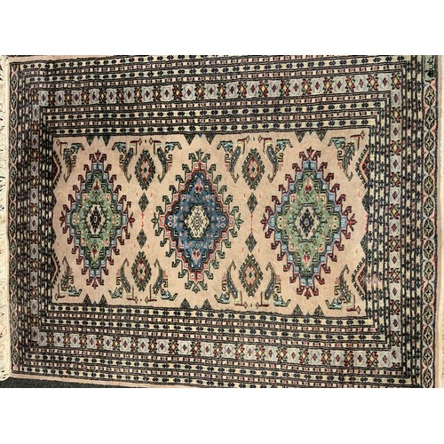 80 - A middle eastern Bokhara, wool and silk mix rug / carpet, knotted with traditional ‘Gul’ motif, 148c... 