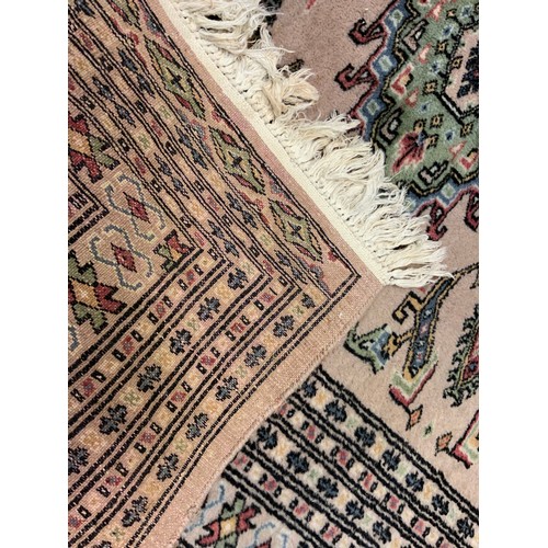 80 - A middle eastern Bokhara, wool and silk mix rug / carpet, knotted with traditional ‘Gul’ motif, 148c... 