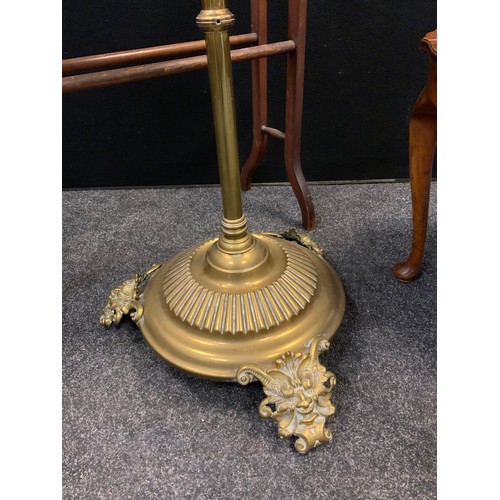 81 - A late 19th / early 20th century brass rise and fall standard lamp, converted for use with electrici... 