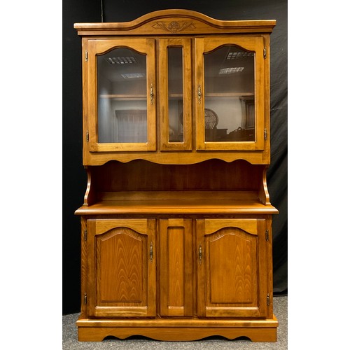 122 - A modern stained beechwood dresser, glazed doors to top, pair of panelled cupboard doors to base, 19... 