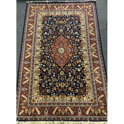 162 - A Persian garden carpet, all over decorated with multi coloured floral motifs, blue ground, approx 3... 