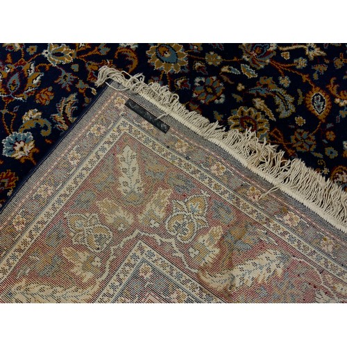 162 - A Persian garden carpet, all over decorated with multi coloured floral motifs, blue ground, approx 3... 