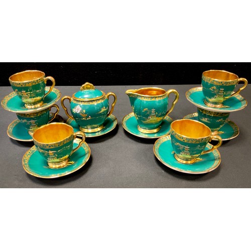 200 - A Carlton Ware Mikado coffee service, printed and painted ion gilt and colours on an emerald ground,... 