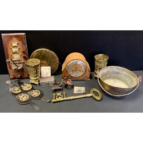 212 - Metal Ware - a jam pan;  horse brasses;  a galleon ship on a plaque;  a gong;  an oak mantel clock; ... 