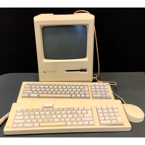 239 - A vintage Mackintosh Plus 1MB computer, two key boards, mouse, introduced on January 16, 1986