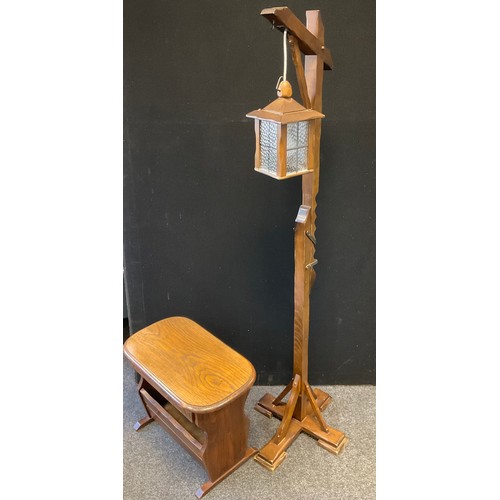 240 - A mid 20th century oak magazine rack/side table, 57cm wide, 44cm high;  an oak hangman lantern side ... 