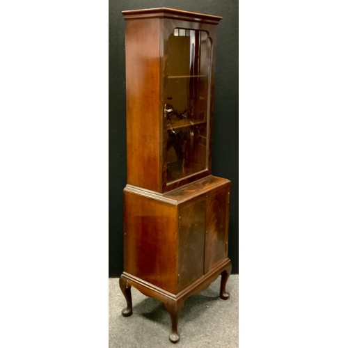 291 - A narrow mahogany book case cabinet, single door glazed top enclosing two shelves, above two door cu... 