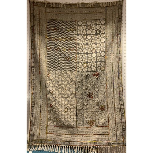 55 - An eastern rug, creamy white panelled geometric ground, with coloured patches, approx 180cm x 125cm