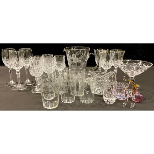 139 - A cut glass pedestal bon-bon dish; an engraved lemonade jug and six associated beakers; wine glasses... 