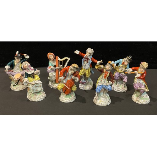 202 - A set of eight Dresden monkey band figures, conductor, drummer, singer, flautist, French horn, viola... 