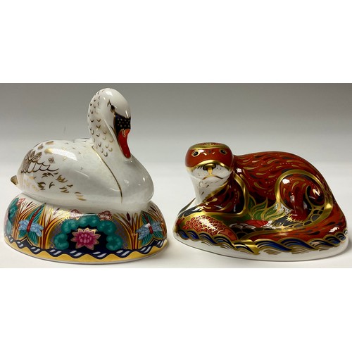 208 - A Royal Crown Derby paperweight, Swan, gold stopper, boxed; another, Otter, gold stopper, boxed (2)