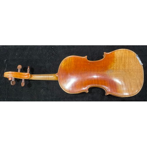 243 - A violin, the two-piece back 31.5cm excluding button, 52cm long overall