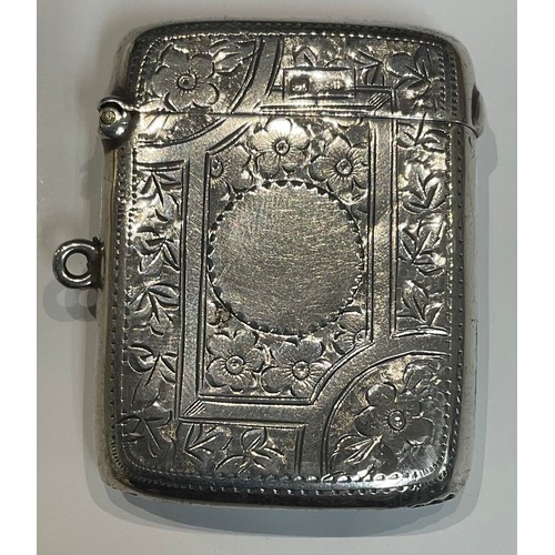 256 - An Edwardian silver vesta case, chased with flowers, 5cm long, Sheffield 1905