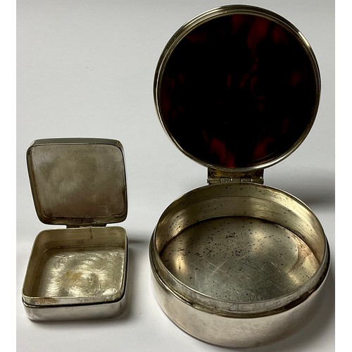 412 - A 19th century silver snuff box, the tortoise shell cover inlaid with silver, 5.5cm diameter; a silv... 