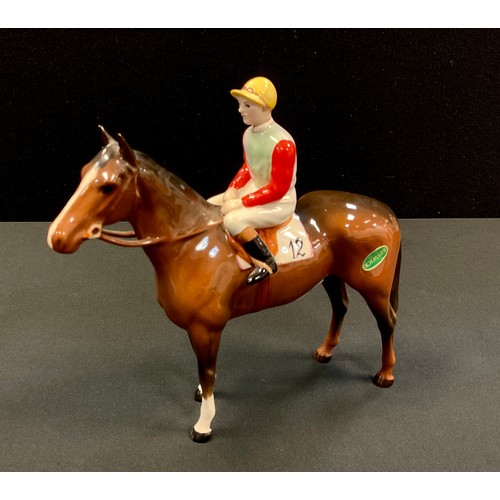 20 - A Beswick Racehorse and Jockey, standing,  brown gloss jockey in light green and light blue silks wi... 