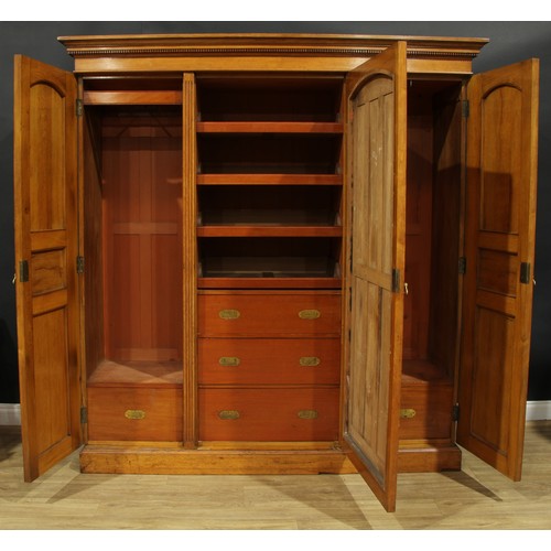 110 - An early 20th century oak wardrobe, 209cm high, 198.5cm wide, 62.5cm deep