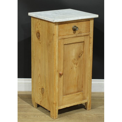 108 - A pine bedroom cabinet, marble top above a frieze drawer and a panel door enclosing a shelf, 80cm hi... 