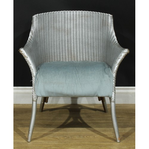 310 - A pair of Lloyd Loom chairs, 67cm high, 64cm wide, the seat 42cm wide and 38cm deep; a box stool, 52... 