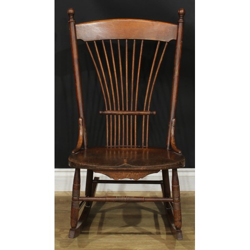 312 - A 19th century rocking chair; a rush seated armchair; an ebonised side chair, c.1890 (3)