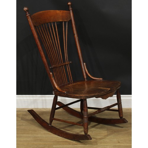 312 - A 19th century rocking chair; a rush seated armchair; an ebonised side chair, c.1890 (3)