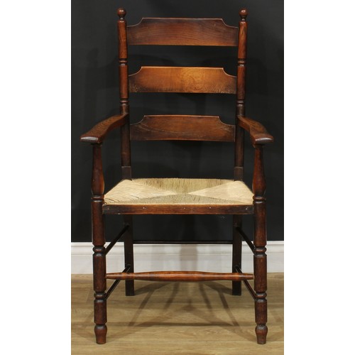 312 - A 19th century rocking chair; a rush seated armchair; an ebonised side chair, c.1890 (3)