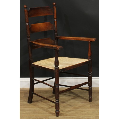 312 - A 19th century rocking chair; a rush seated armchair; an ebonised side chair, c.1890 (3)