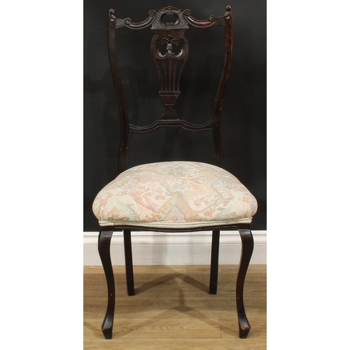 312 - A 19th century rocking chair; a rush seated armchair; an ebonised side chair, c.1890 (3)