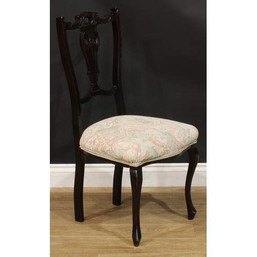 312 - A 19th century rocking chair; a rush seated armchair; an ebonised side chair, c.1890 (3)