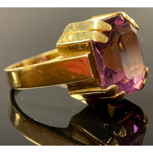 553 - An 18ct and palladium gold ring, set with a single faceted amethyst, size O, marked 18CTPALL, 10.8g