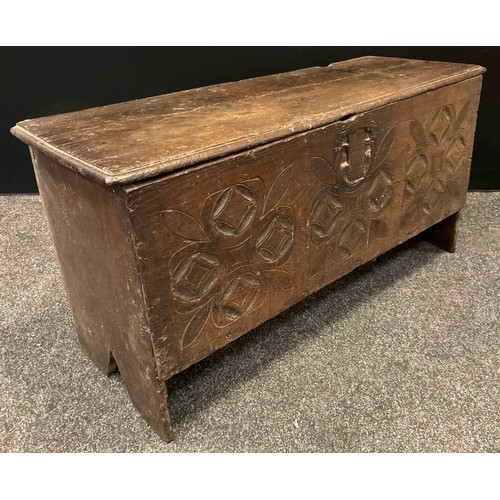 149 - An 18th century  six plank chest, the front carved with roundels and leaves,  48cm high, 95cm wide, ... 