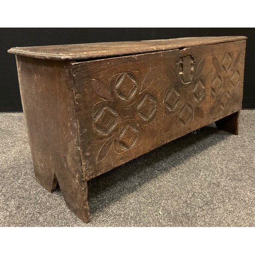 149 - An 18th century  six plank chest, the front carved with roundels and leaves,  48cm high, 95cm wide, ... 