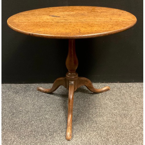 137 - A George III oak circular occasional table, tilting on  turned baluster-form column, cabriole legs, ... 