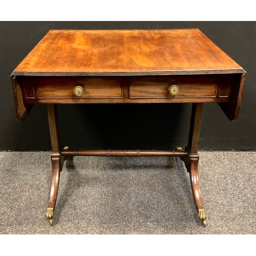 130 - A George III mahogany sofa table, rounded rectangular over-sailing top with reeded edge, pair of sho... 