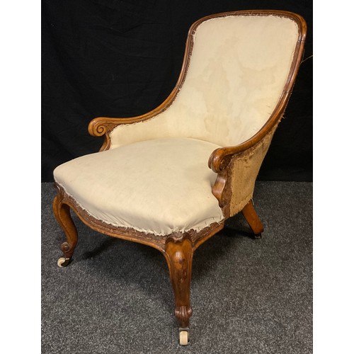 121 - An early Victorian mahogany nursing chair, arched back, scroll arms, stuffed-over seat, cabriole leg... 