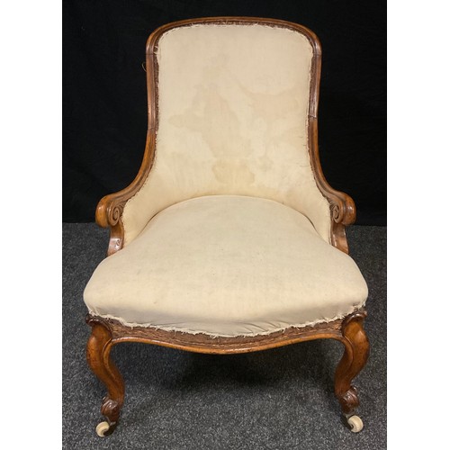 121 - An early Victorian mahogany nursing chair, arched back, scroll arms, stuffed-over seat, cabriole leg... 