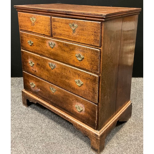 115 - A George III oak chest,  of two short over three long drawers, brass swan-neck handles, bracket feet... 