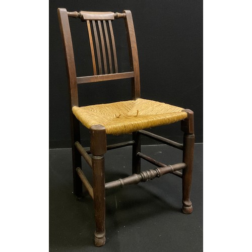 112 - A set of five 19th century oak and elm dining chairs, rush seats. turned stretchers, c.1840