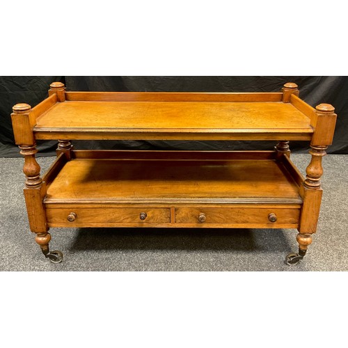 162 - A 19th century mahogany two-tier dumb waiter, two drawers to frieze, brass casters, 72cm high,  120.... 